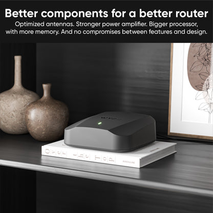 Wyze Mesh Router Pro on a bookshelf.